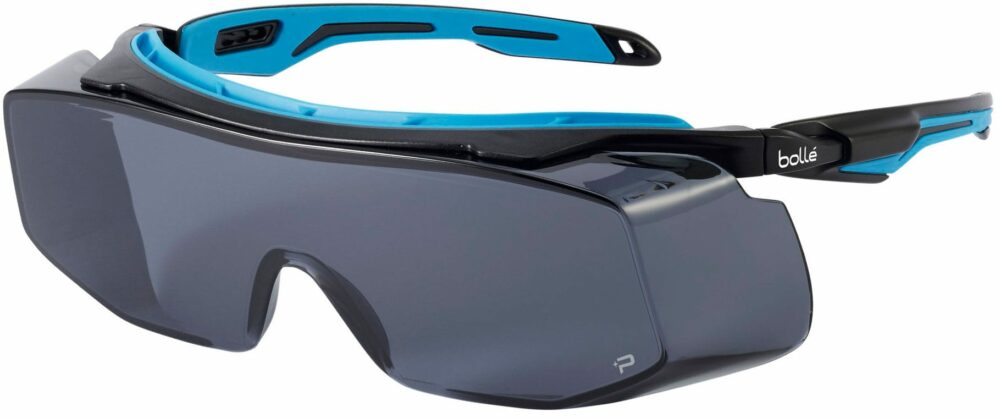 Bolle Tryon OTG Safety Glasses in a Black and Blue Frame with Smoke Platinum Lenses. Angled Left